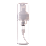 A clear, empty foam bottle designed for eyelash shampoo with a pump dispenser. Empty 60 ml foam bottle for eyelash extension shampoo, foaming dispenser, professional reusable bottle for lash cleansing.